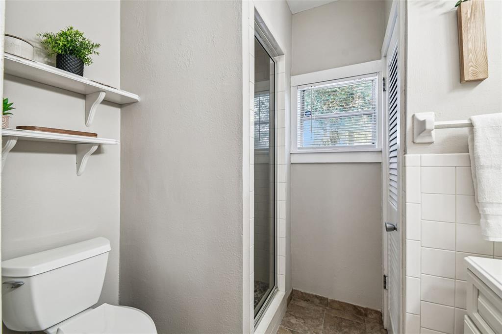 8011 North Mobley Road Odessa, FL 33556 - Photo 51 of 86 a white toilet sitting next to a bathroom sink