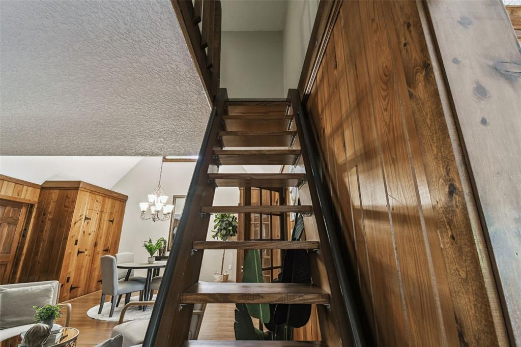 8011 North Mobley Road Odessa, FL 33556 - Photo 59 of 86 a view of staircase with railing and white walls