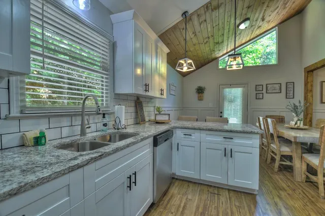 a kitchen with a sink and cabinets