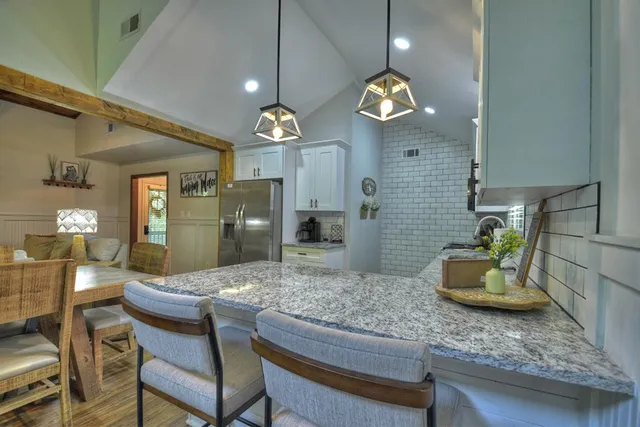 a kitchen with a table and chairs in it