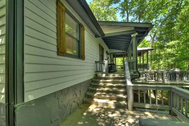 a view of a porch with wooden walls