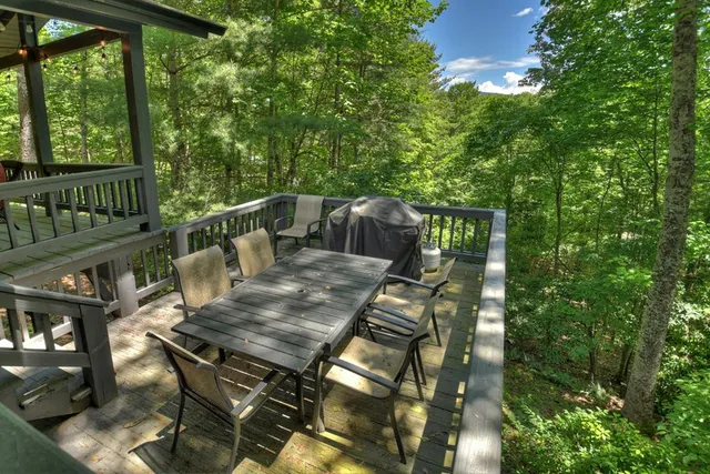 a view of chairs on wooden deck