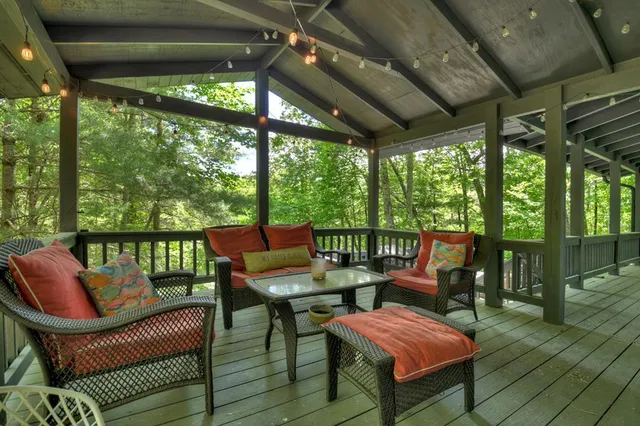 a view of two chairs in the balcony