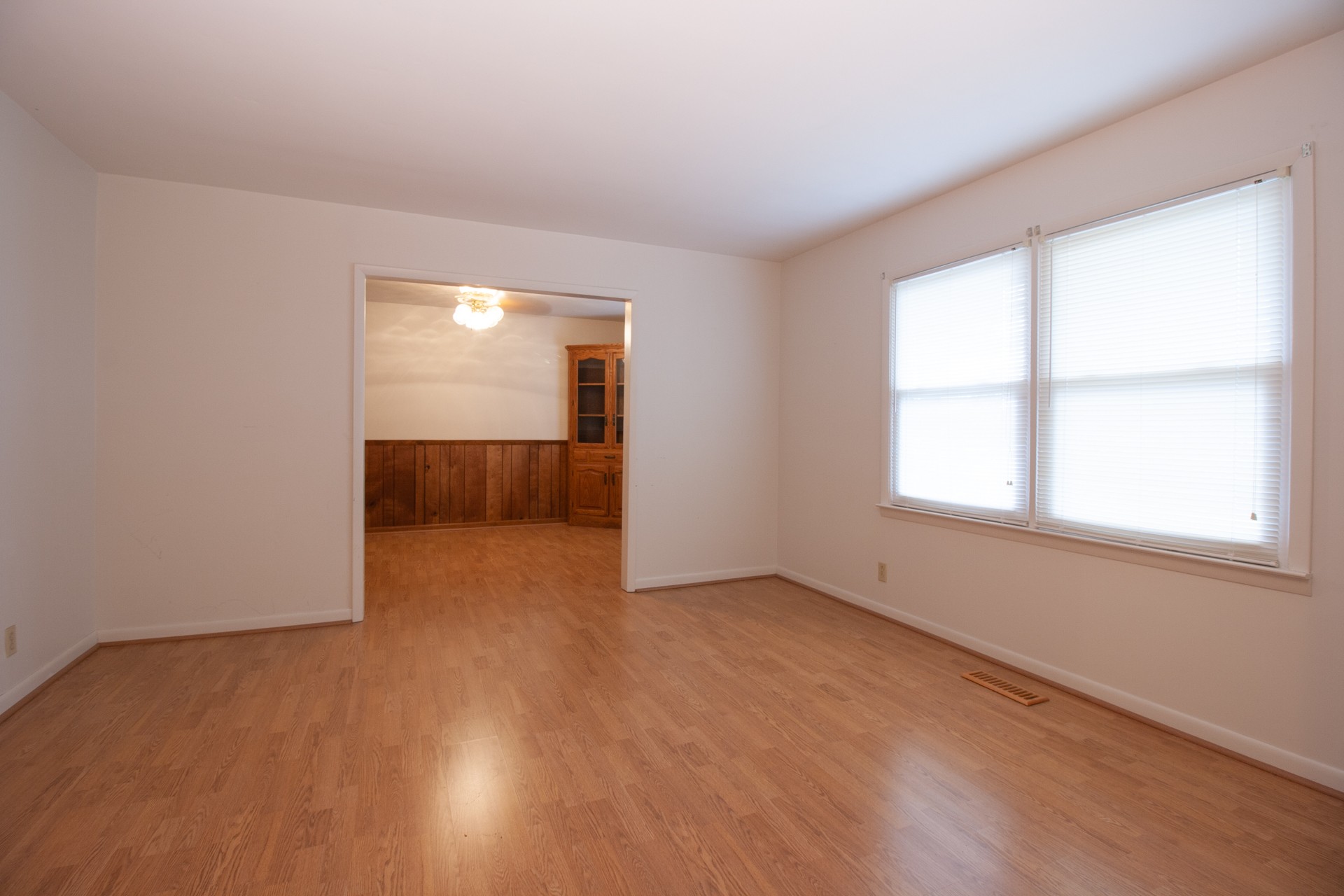 1431 Harrison Road Murfreesboro, TN 37128 - Photo 11 of 17 an empty room with wooden floor and windows