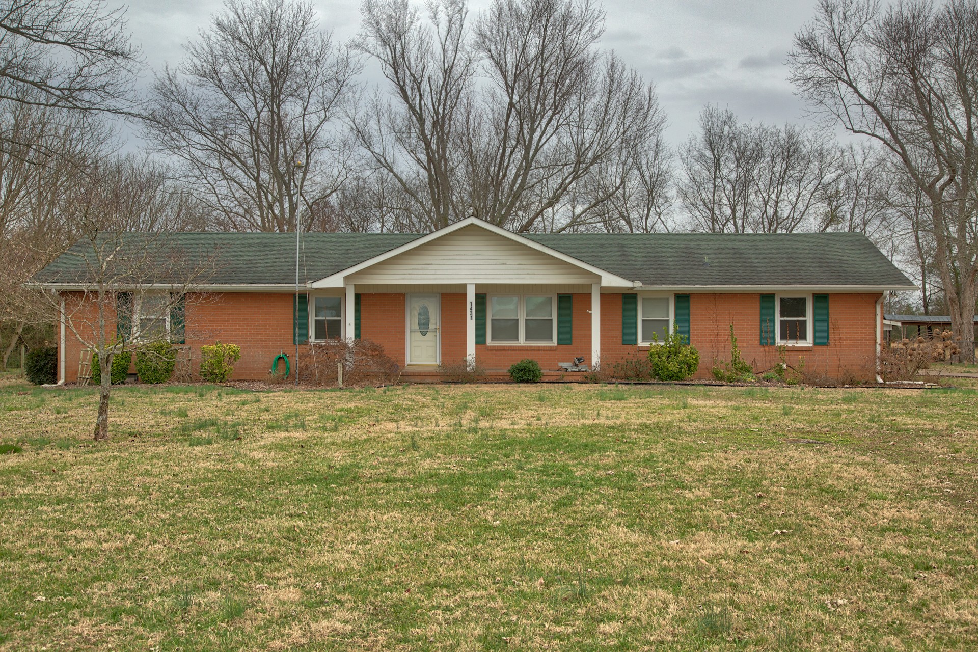 1431 Harrison Road Murfreesboro, TN 37128 - Photo 3 of 17 a front view of a house with a garden