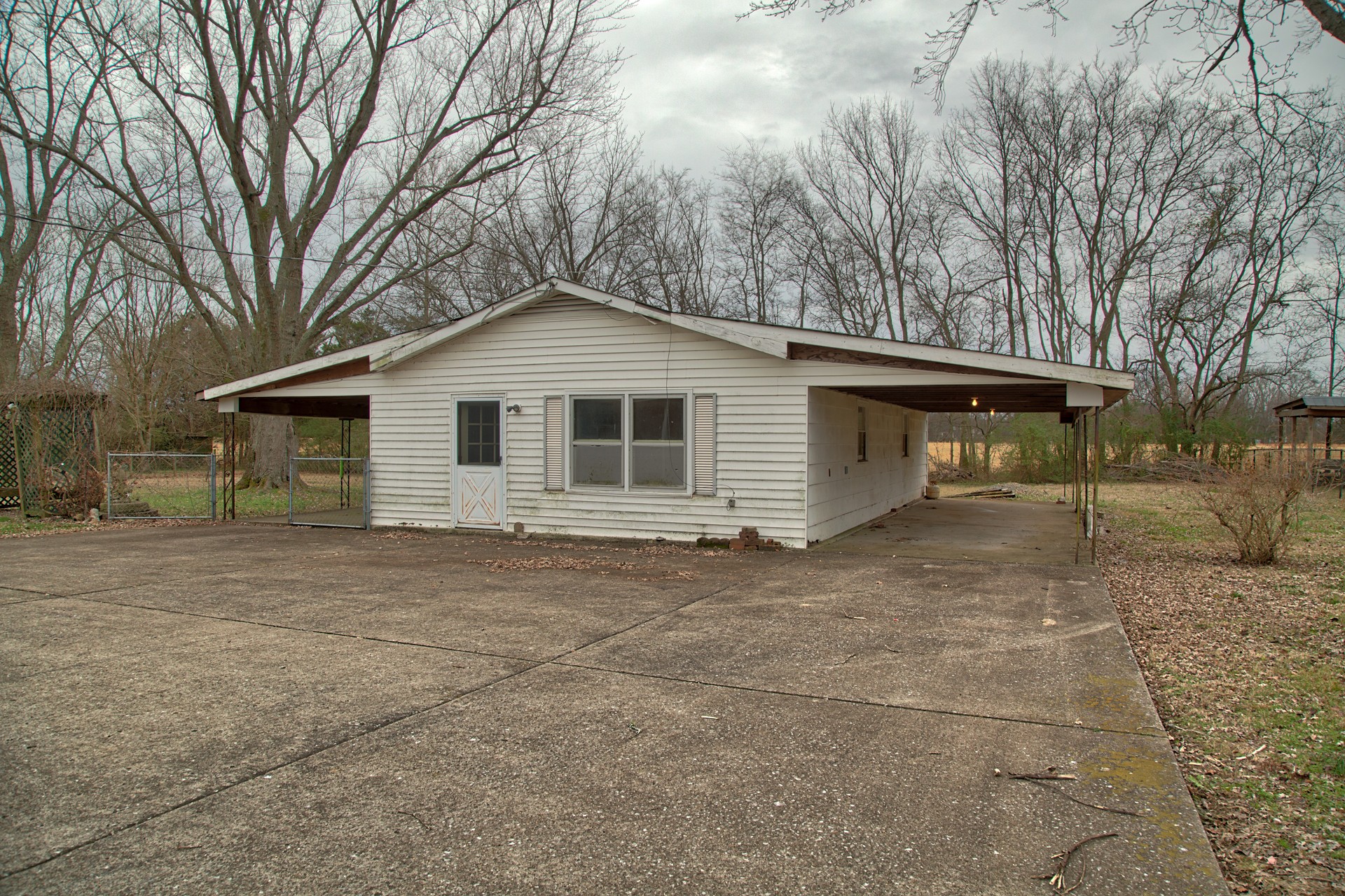1431 Harrison Road Murfreesboro, TN 37128 - Photo 4 of 17 a view of a house with a yard and garage