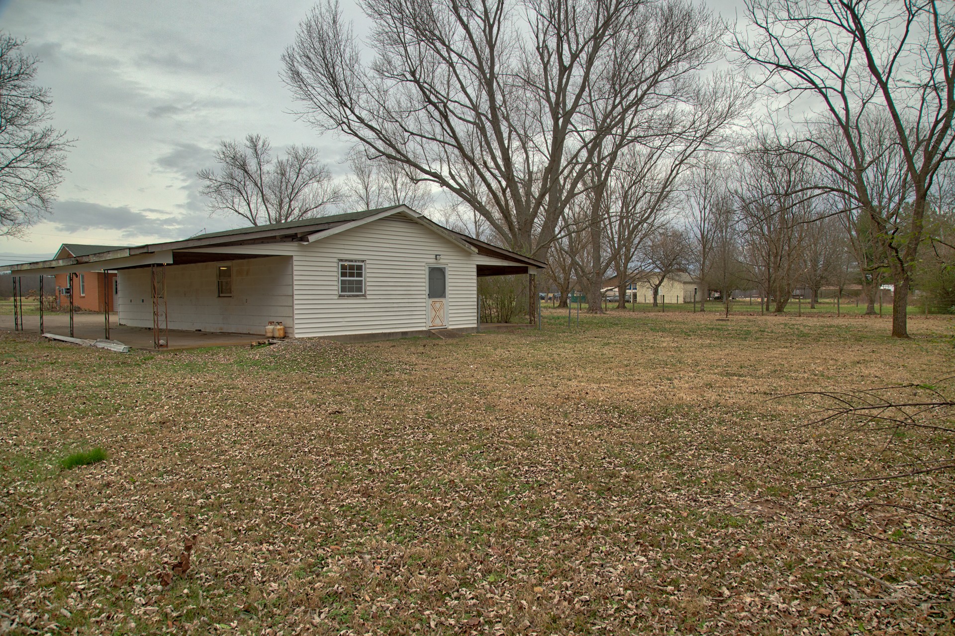 1431 Harrison Road Murfreesboro, TN 37128 - Photo 5 of 17 a big house with a big yard and large trees