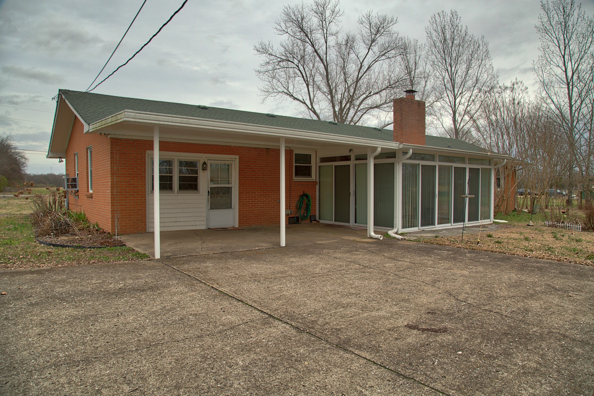 1431 Harrison Road Murfreesboro, TN 37128 - Photo 7 of 17 a view of a house with a large space and large tree