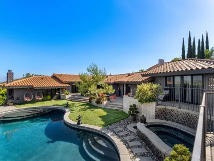 a view of a swimming pool with a patio