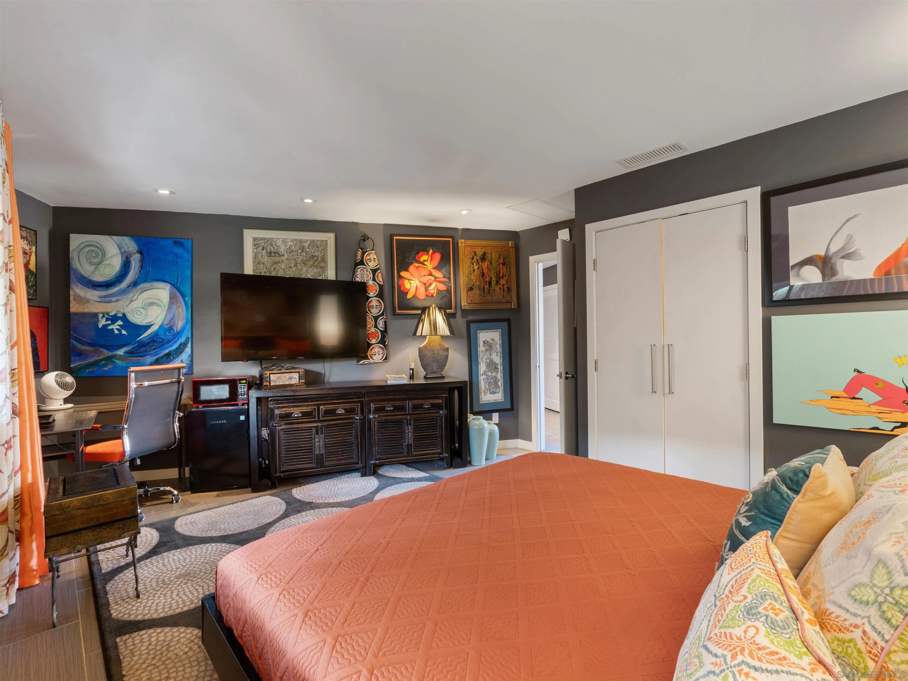 6315 Ridge Manor Avenue San Diego, CA 92120 - Photo 28 of 45 a bedroom with a bed and a flat screen tv