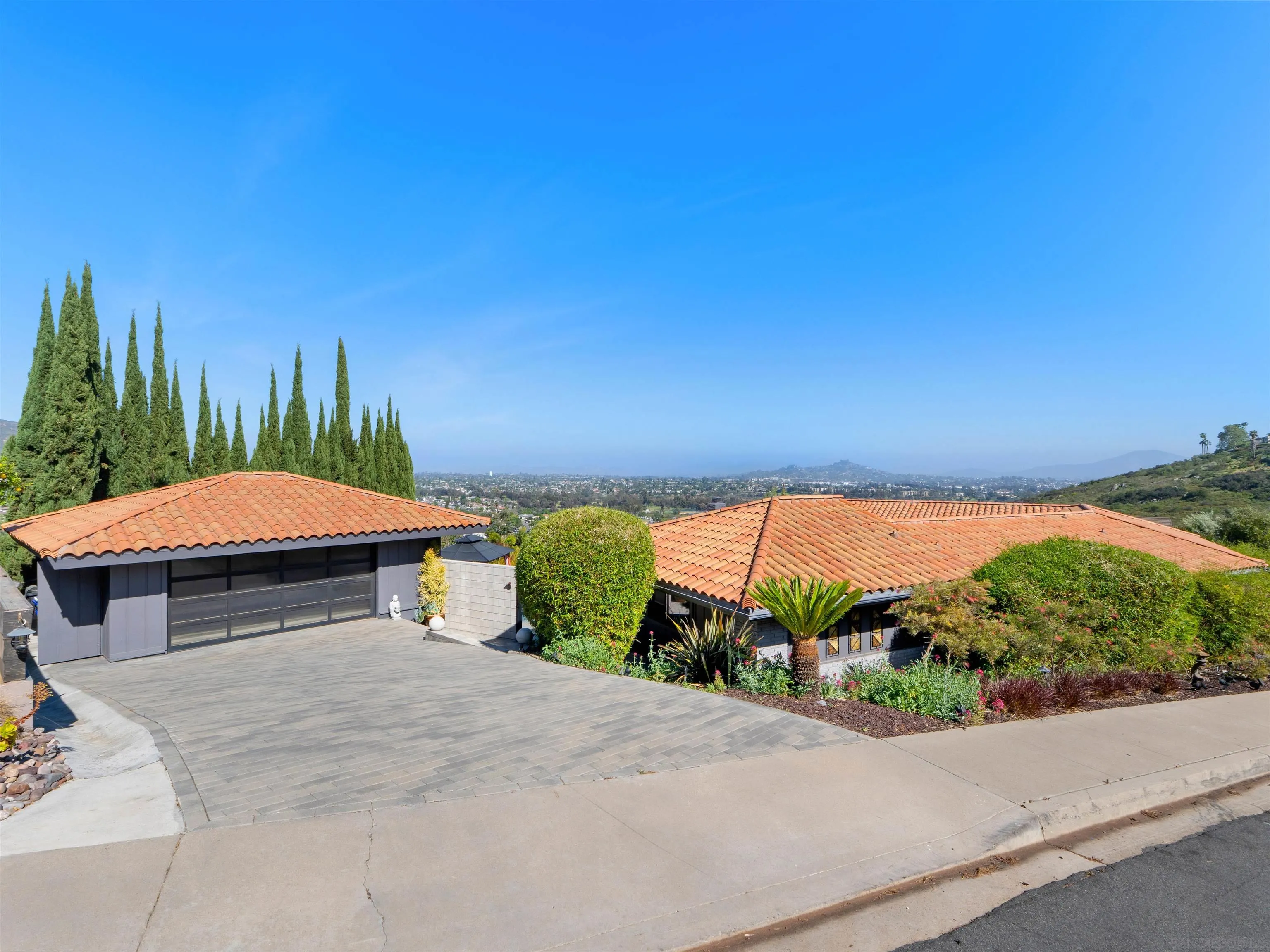 6315 Ridge Manor Avenue San Diego, CA 92120 - Photo 38 of 45 a view of a terrace with a garden