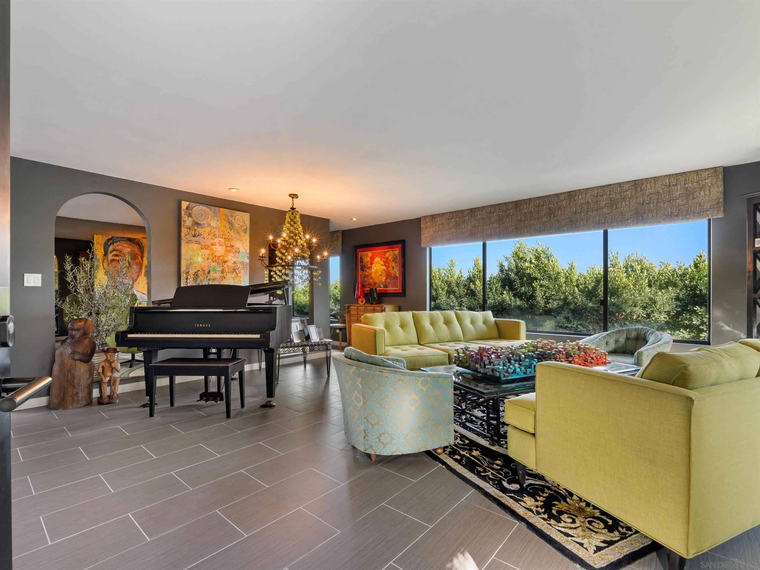 6315 Ridge Manor Avenue San Diego, CA 92120 - Photo 6 of 45 a living room with furniture a piano and a floor to ceiling window