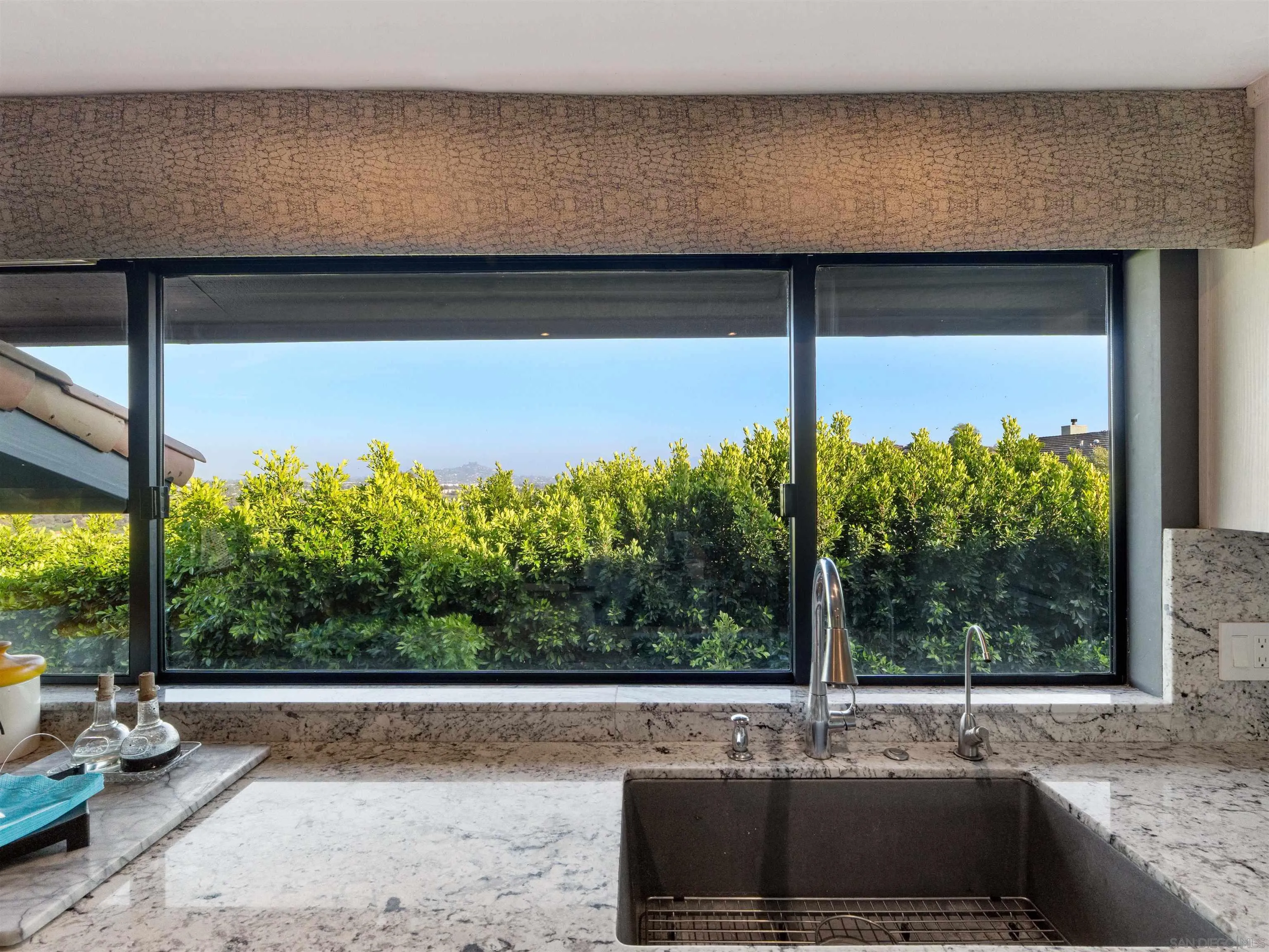 6315 Ridge Manor Avenue San Diego, CA 92120 - Photo 10 of 45 a view of a living room and floor to ceiling window