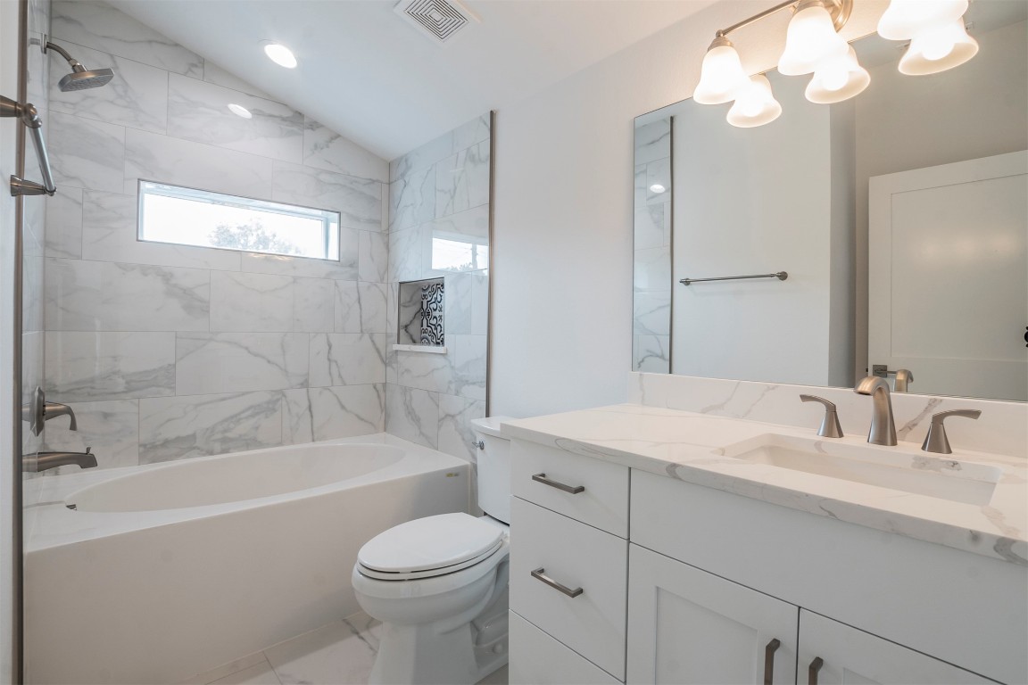 616 West Dittmar Road Austin, TX 78745 - Photo 12 of 37 a bathroom with a sink a toilet and bathtub