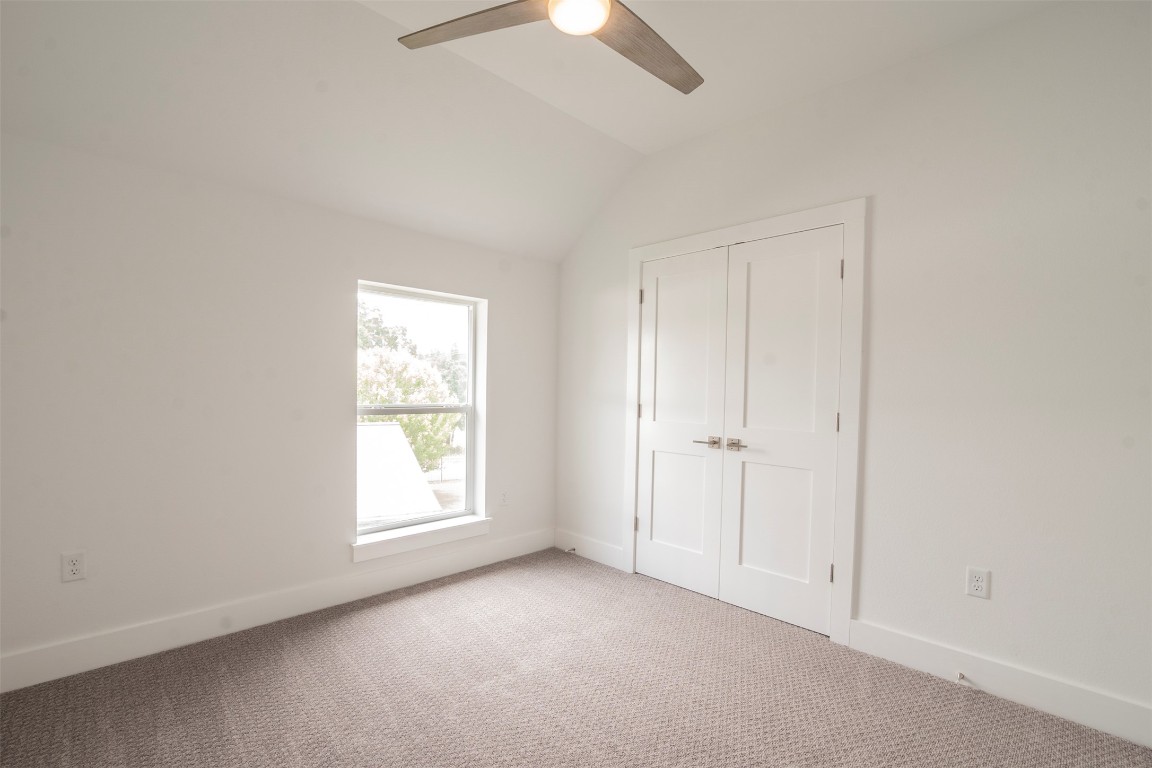 616 West Dittmar Road Austin, TX 78745 - Photo 14 of 37 an empty room with a window and a ceiling fan