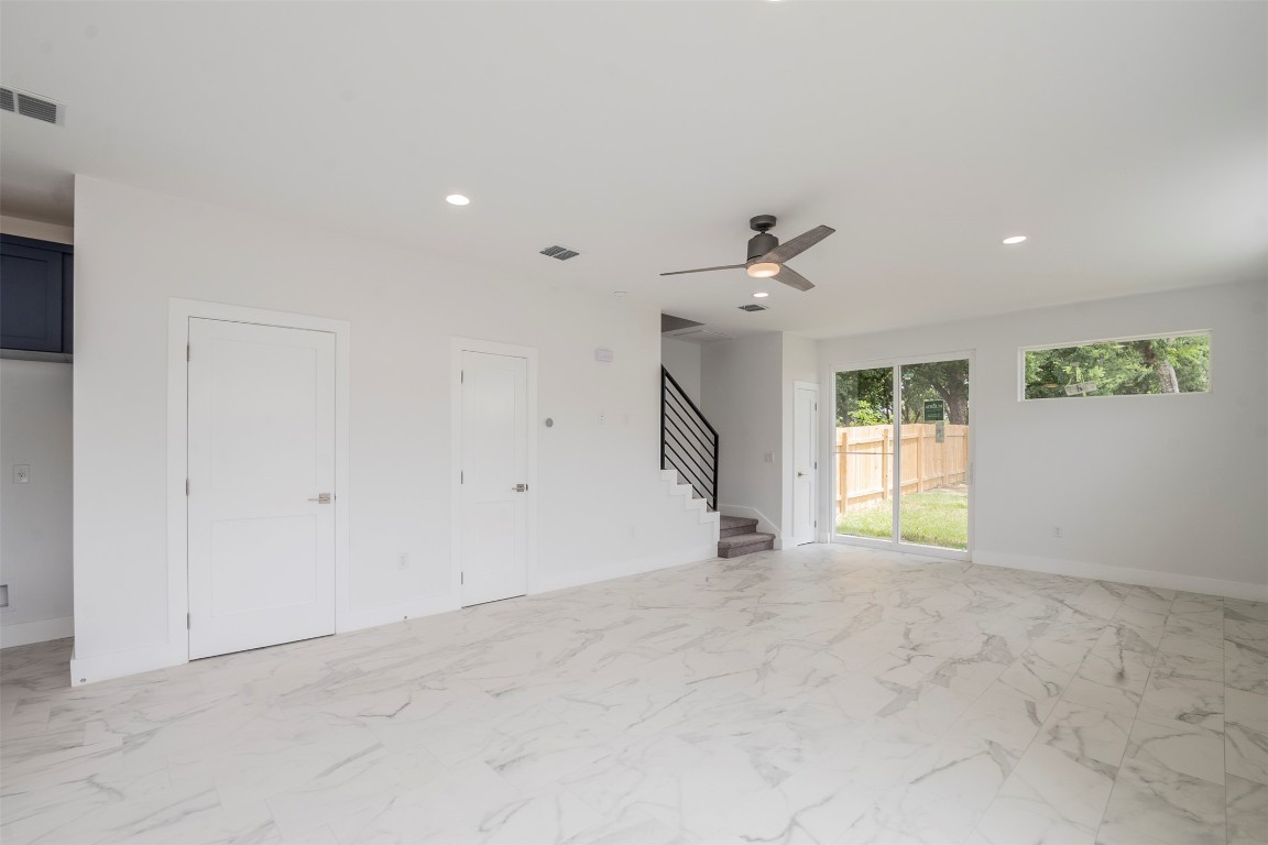 616 West Dittmar Road Austin, TX 78745 - Photo 2 of 37 an empty room with windows and ceiling fan
