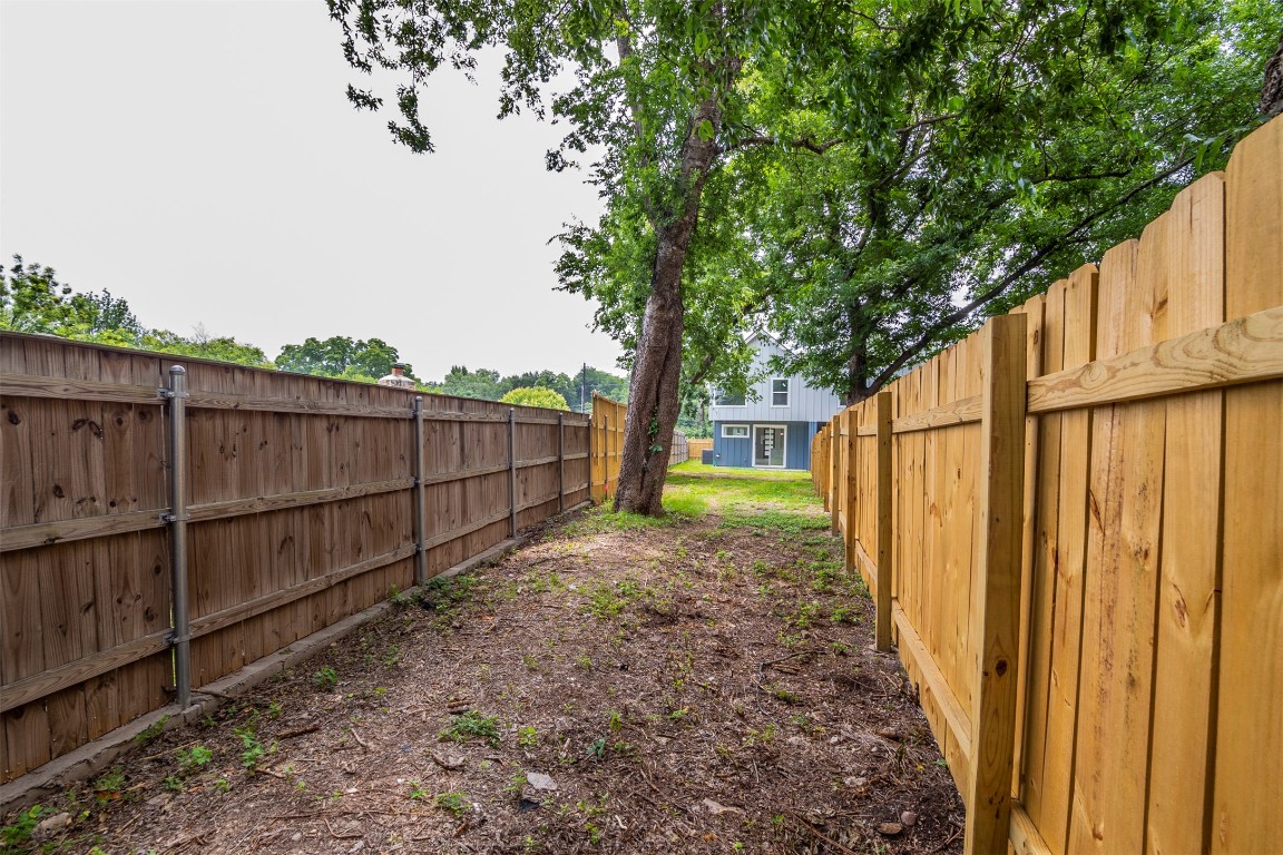 616 West Dittmar Road Austin, TX 78745 - Photo 25 of 37 a view of a backyard with wooden fence