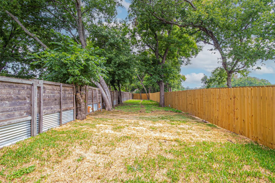 616 West Dittmar Road Austin, TX 78745 - Photo 26 of 37 a view of backyard with wooden fence and large trees