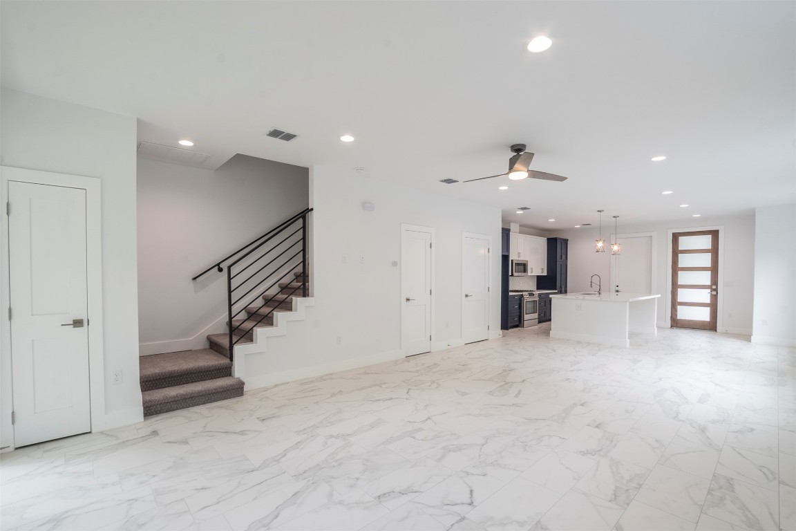 616 West Dittmar Road Austin, TX 78745 - Photo 32 of 37 an empty room with a kitchen and entryway