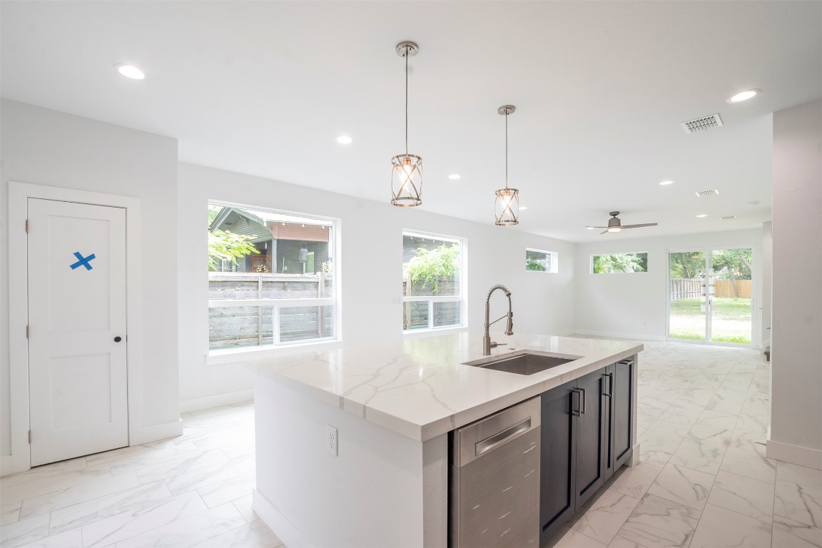 616 West Dittmar Road Austin, TX 78745 - Photo 34 of 37 a kitchen that has a sink a window and a table in it