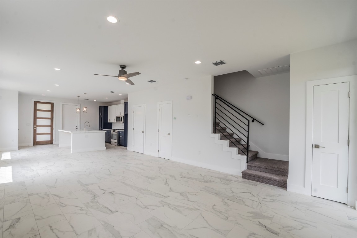 616 West Dittmar Road Austin, TX 78745 - Photo 5 of 37 wooden floor in an empty room and a ceiling fan