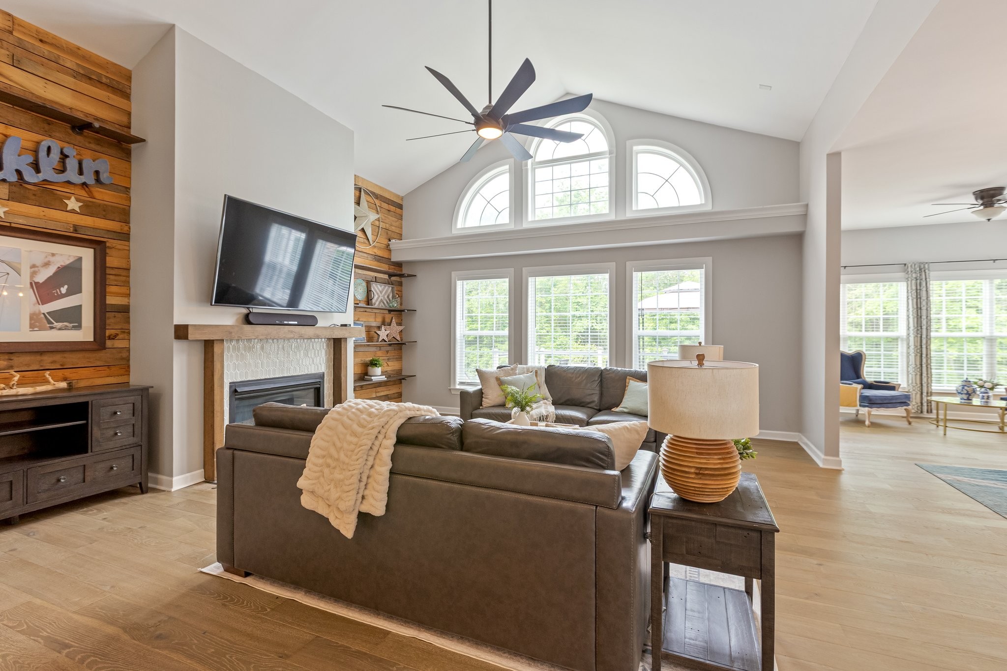 5048 Abington Ridge Lane Franklin, TN 37067 - Photo 12 of 64 a living room with furniture a fireplace and a flat screen tv