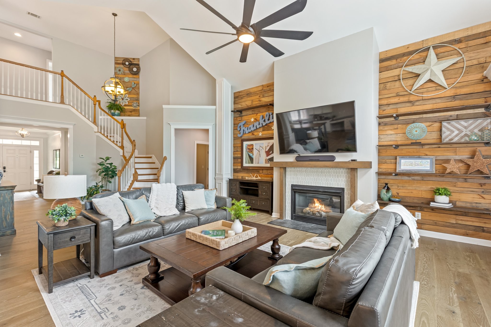 5048 Abington Ridge Lane Franklin, TN 37067 - Photo 15 of 64 a living room with furniture a fireplace and a flat screen tv