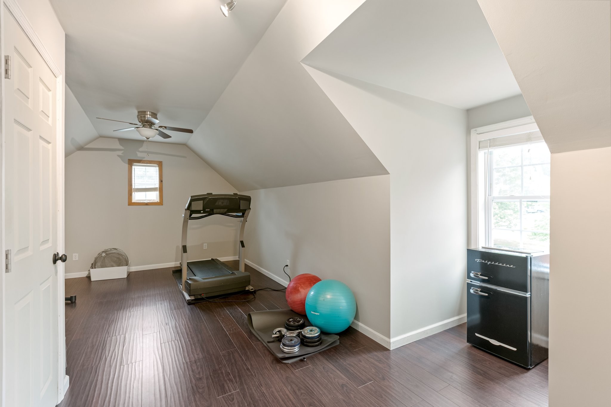 5048 Abington Ridge Lane Franklin, TN 37067 - Photo 51 of 64 a room with wooden floor and gym equipment