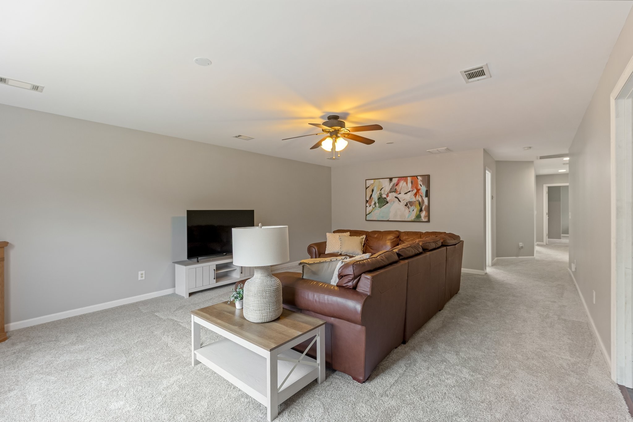 5048 Abington Ridge Lane Franklin, TN 37067 - Photo 53 of 64 a living room with furniture and a chandelier