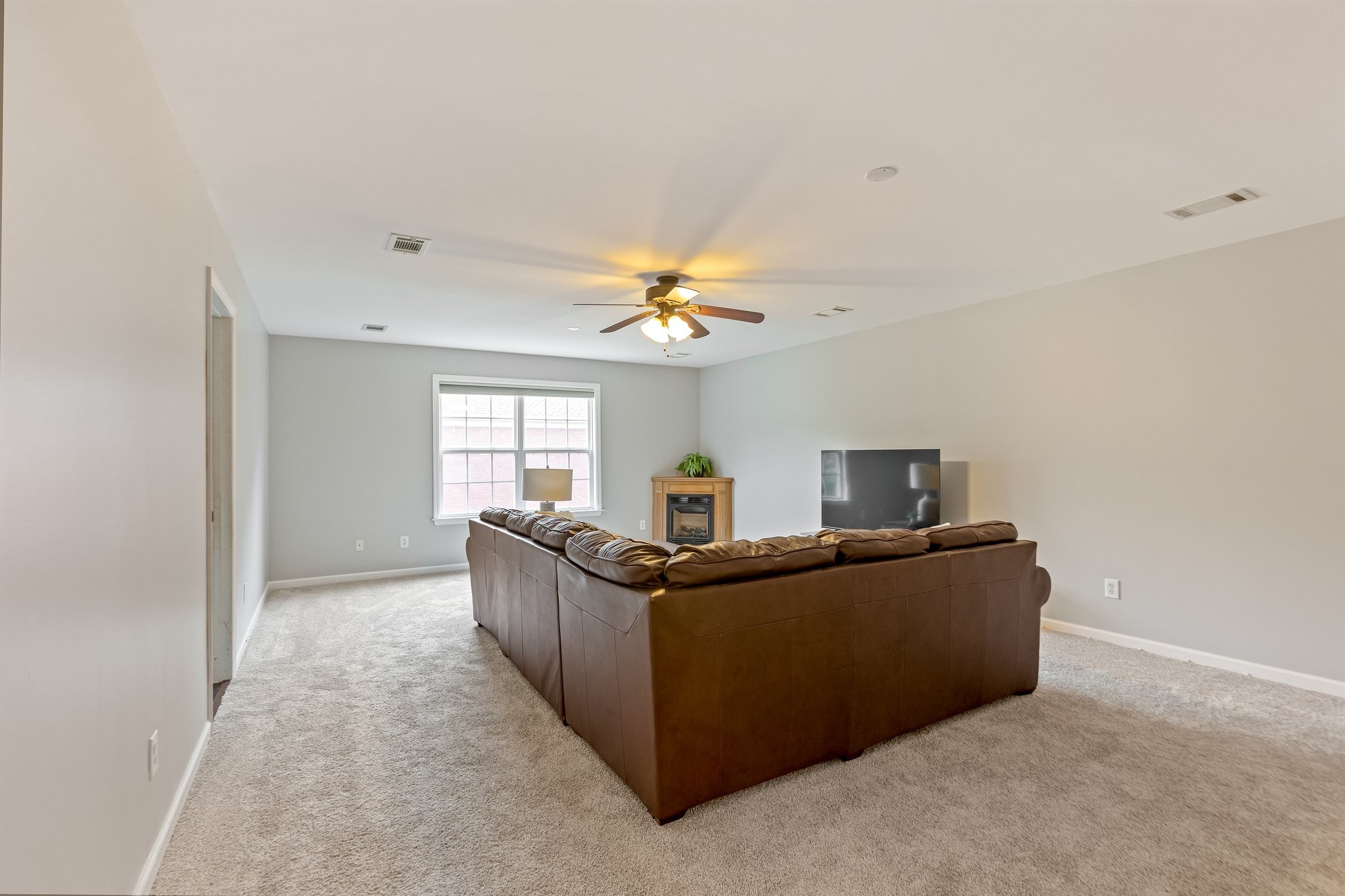 5048 Abington Ridge Lane Franklin, TN 37067 - Photo 56 of 64 a living room with furniture and a window