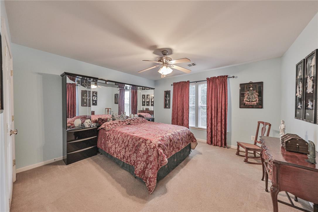 138 Clover Hollow Road Easton, PA 18045 - Photo 34 of 95 A comfortable bedroom features plush carpeting and a convenient ceiling fan for ultimate relaxation.