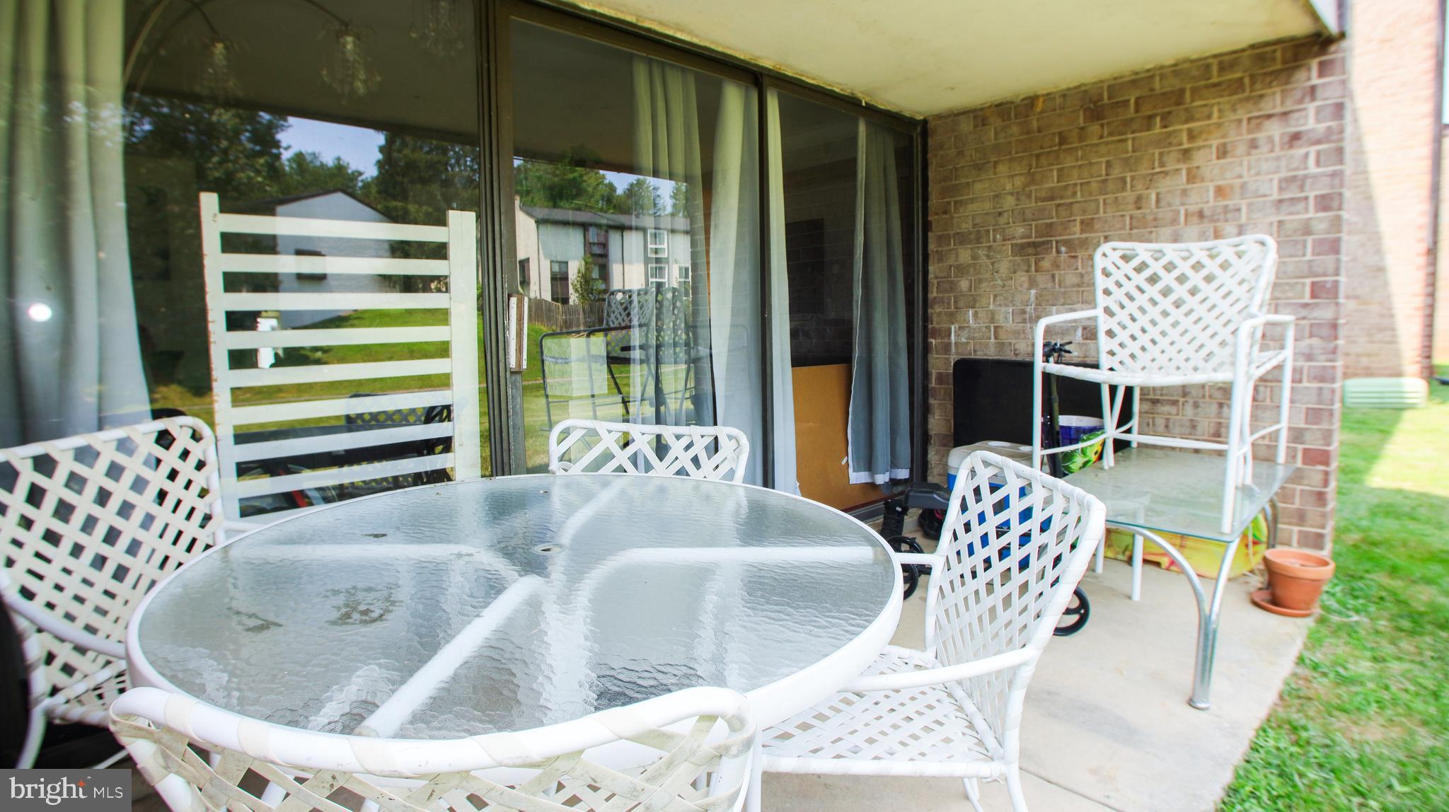 18925 Mills Choice Road, Unit 18925 Gaithersburg, MD 20886 - Photo 12 of 12 a outdoor dining space with furniture