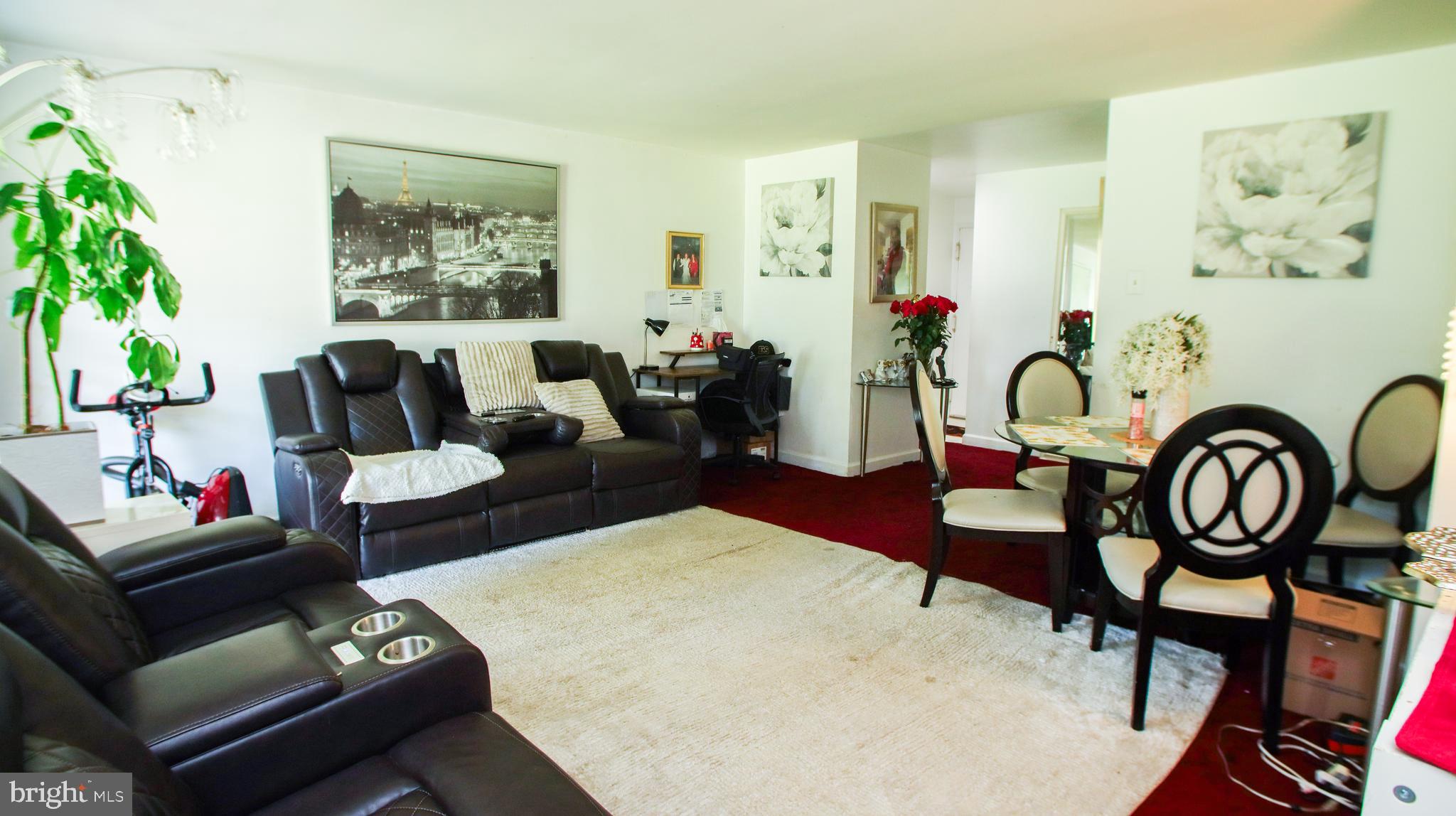18925 Mills Choice Road, Unit 18925 Gaithersburg, MD 20886 - Photo 7 of 12 a living room with furniture and wooden floor