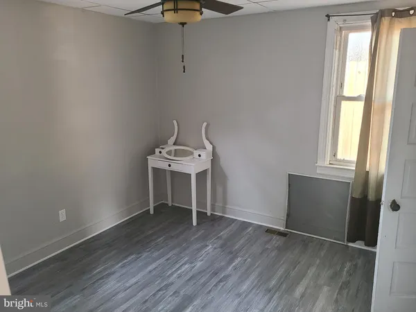a kitchen with stainless steel appliances granite countertop a refrigerator and a stove