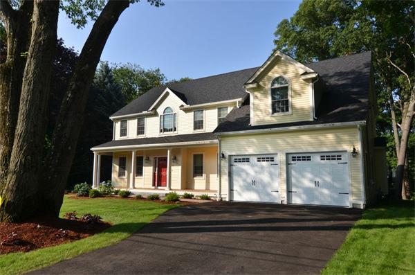 8 Douglas Road Lexington, MA 02420 - Photo 1 of 25 a front view of a house with garden