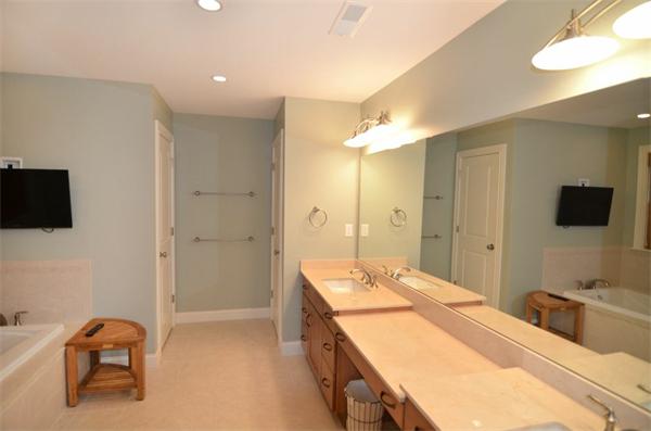 8 Douglas Road Lexington, MA 02420 - Photo 22 of 25 a spacious bathroom with a granite countertop sink and a mirror