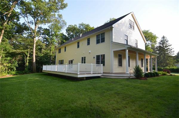 8 Douglas Road Lexington, MA 02420 - Photo 6 of 25 a view of a house with a yard and deck