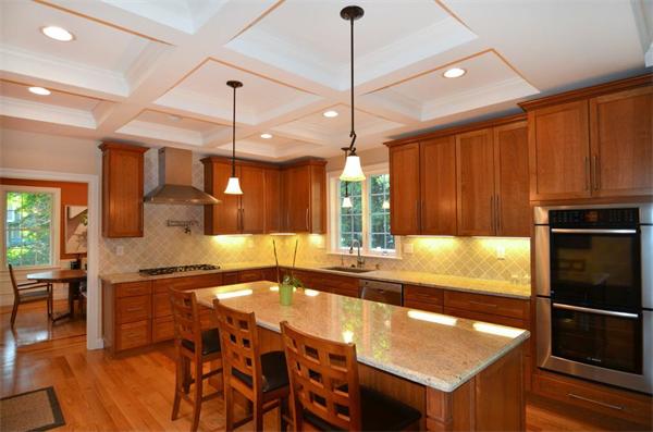 8 Douglas Road Lexington, MA 02420 - Photo 7 of 25 a kitchen with stainless steel appliances granite countertop a sink a stove and a refrigerator