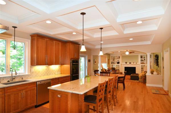 8 Douglas Road Lexington, MA 02420 - Photo 8 of 25 a open kitchen with stainless steel appliances granite countertop a stove kitchen island a sink dishwasher a dining table and chairs with wooden floor