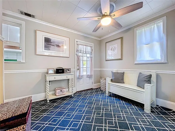 a living room with a couch and a stove top oven