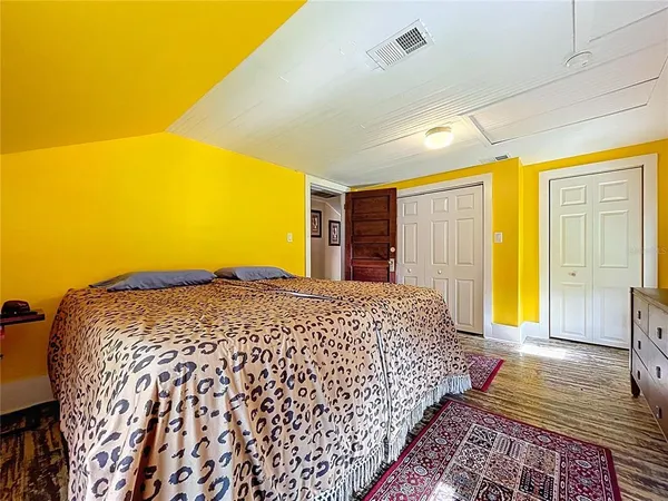 a bedroom with a bed and a table in it