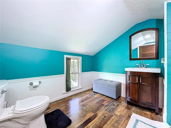 an aerial view of a house with garden space and street view