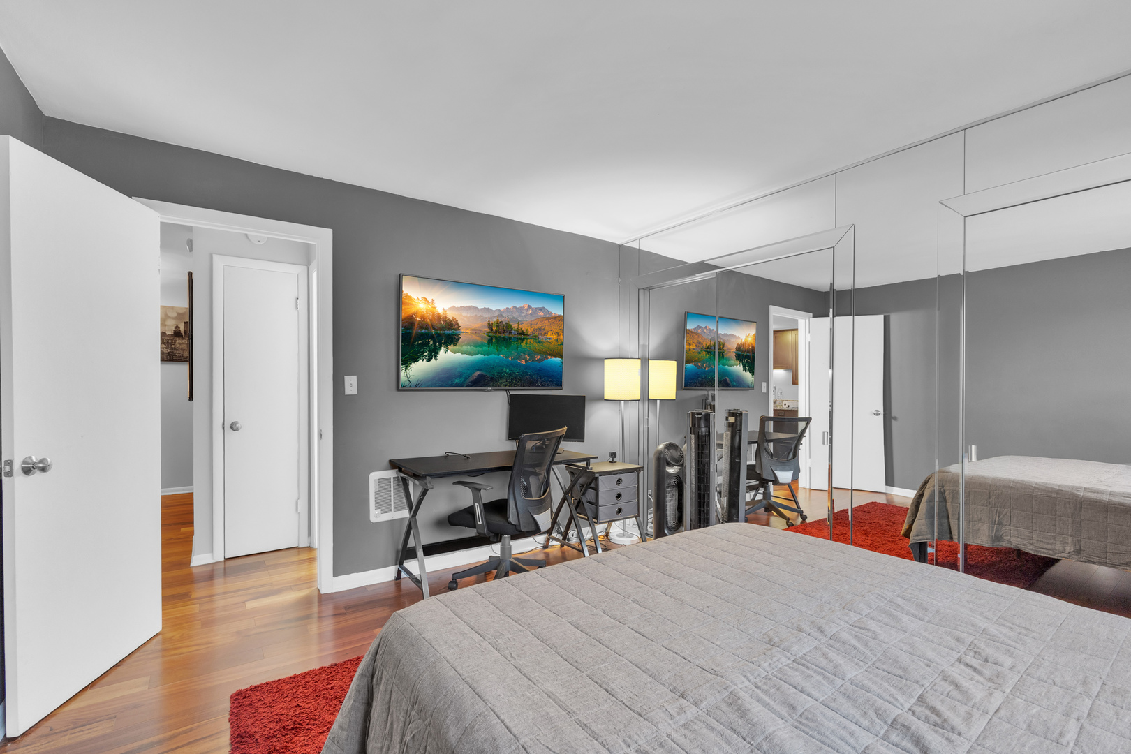 320 Circle Avenue, Unit 404 Forest Park, IL 60130 - Photo 12 of 16 a bed room with a bed a television and a large window