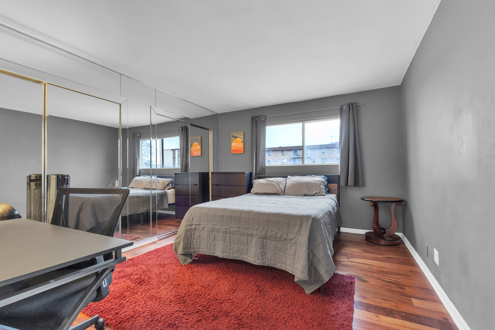 320 Circle Avenue, Unit 404 Forest Park, IL 60130 - Photo 10 of 16 a bedroom with a bed wooden floor and window