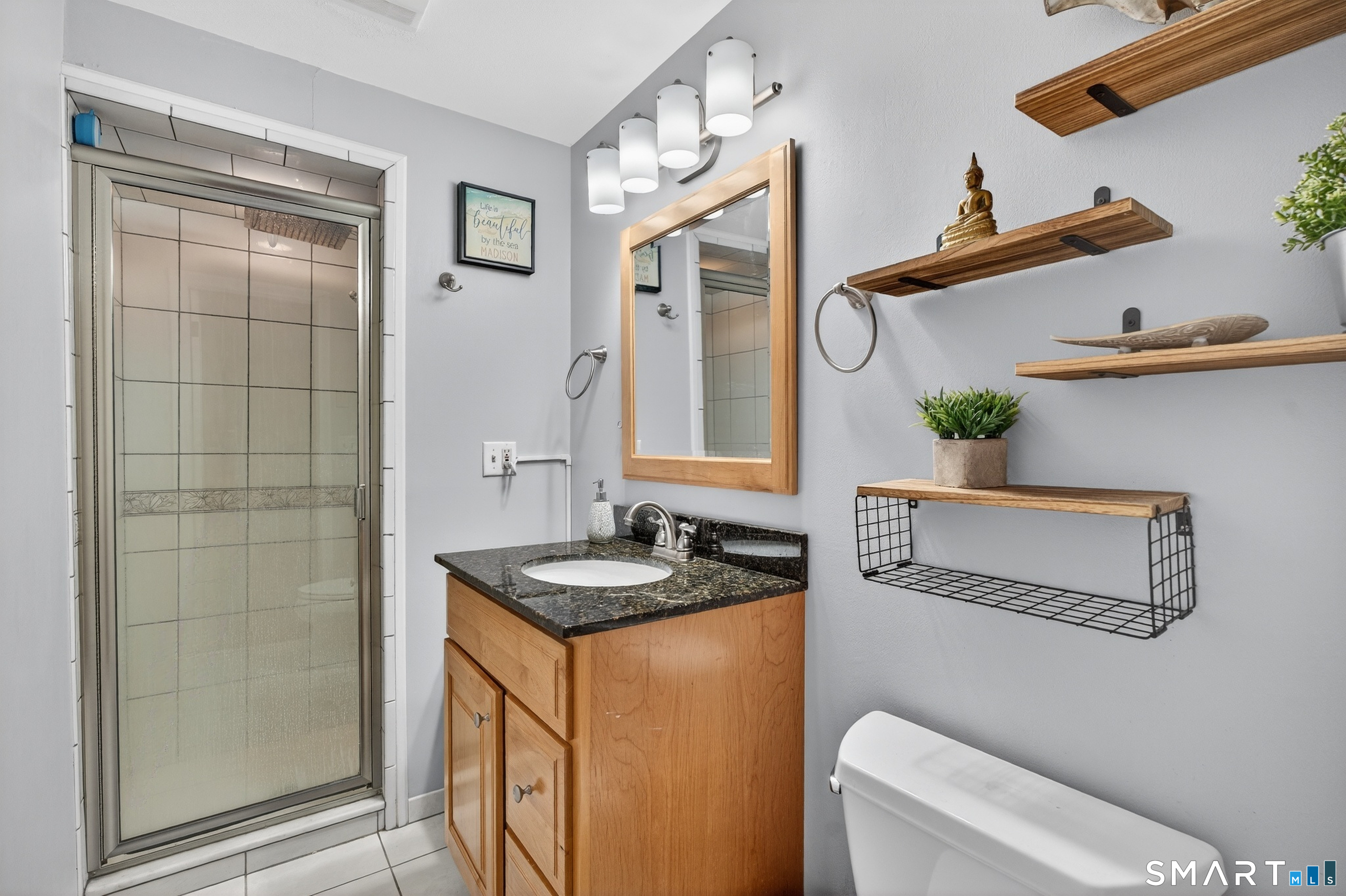 18 Riverside Terrace Madison, CT 06443 - Photo 25 of 40 a bathroom with a sink and a mirror