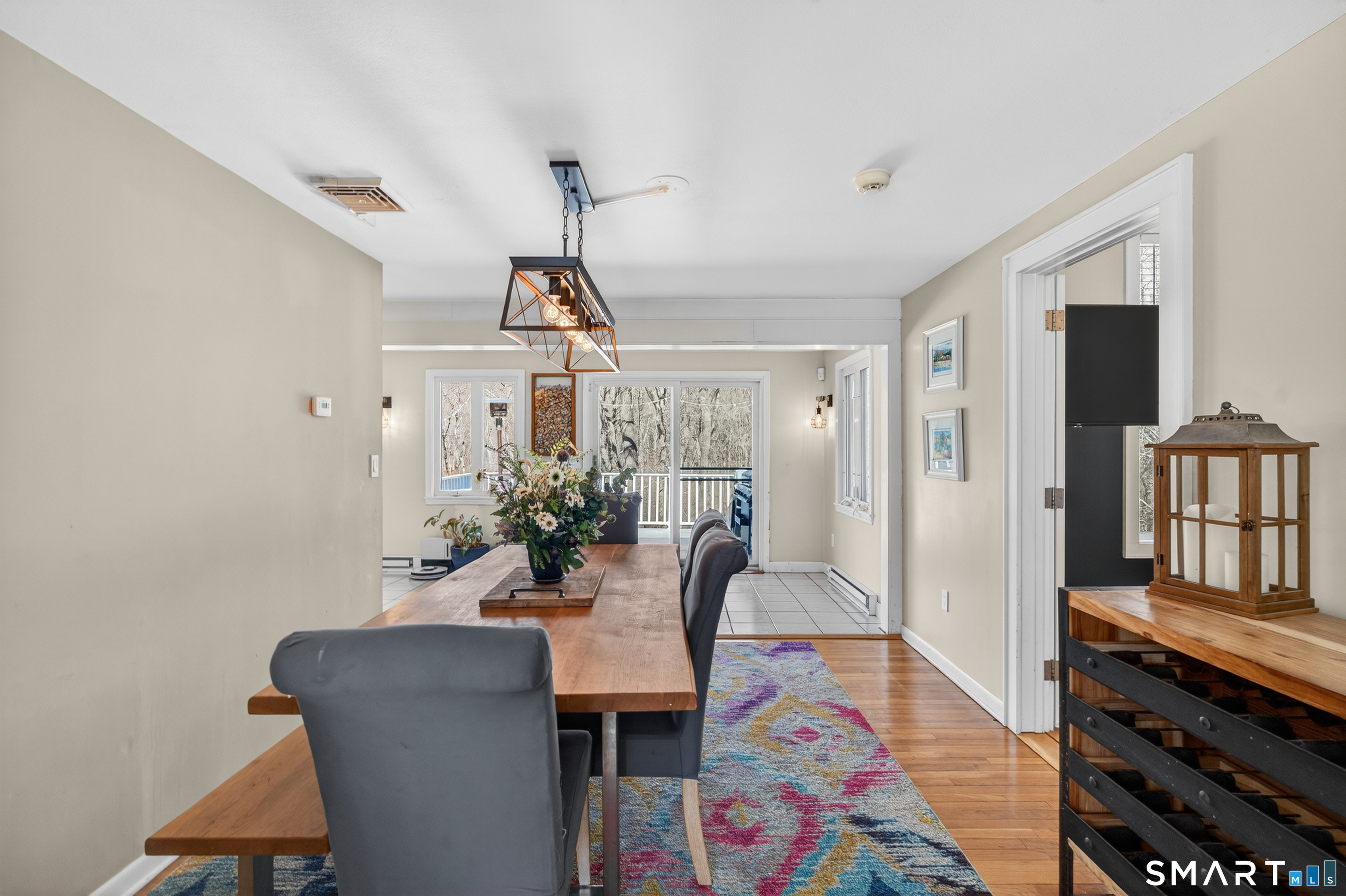 18 Riverside Terrace Madison, CT 06443 - Photo 9 of 40 a dining room with furniture and wooden floor