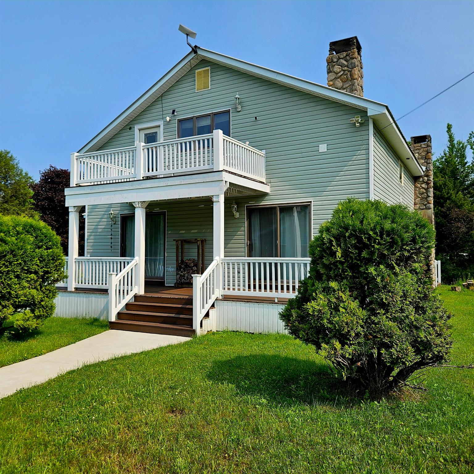 141 Bonnie Brook Road Roscoe, NY 12776 - Photo 3 of 48 View of front facade with a balcony, a chimney, a porch, and a front yard