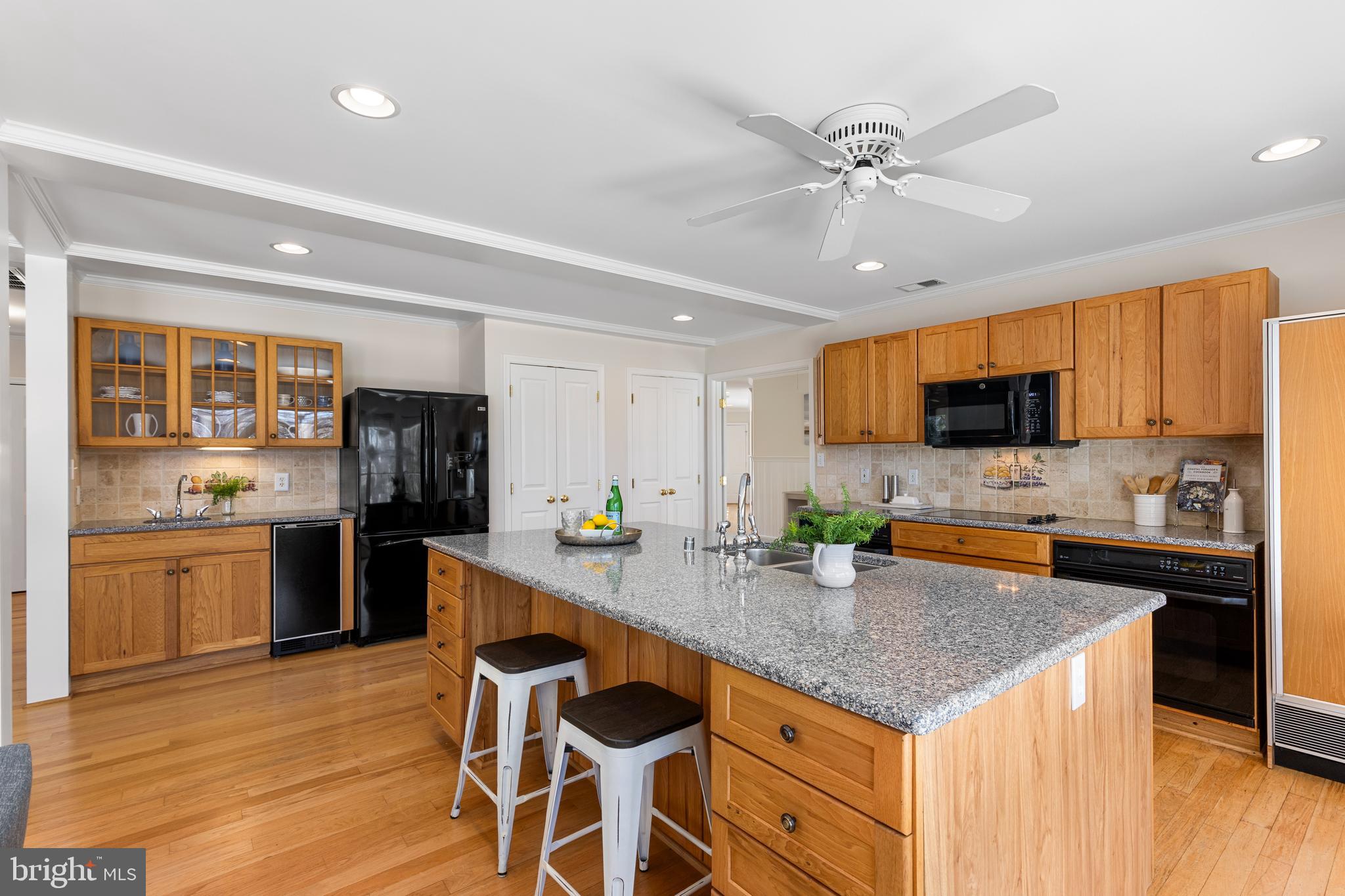 Large island with seating and lots of cabinets