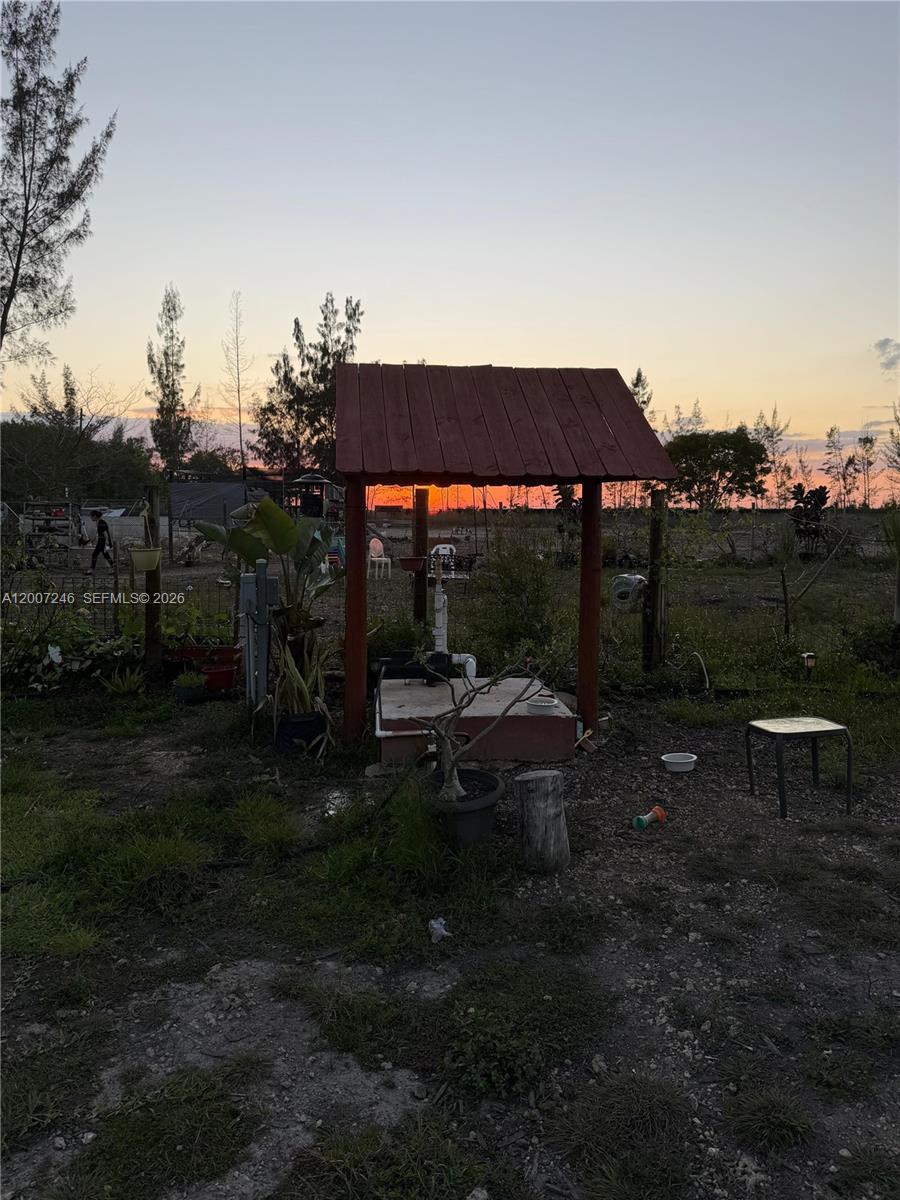 14370 Southwest 208th Avenue Miami, FL 33196 - Photo 11 of 19 a view of a backyard with sitting area