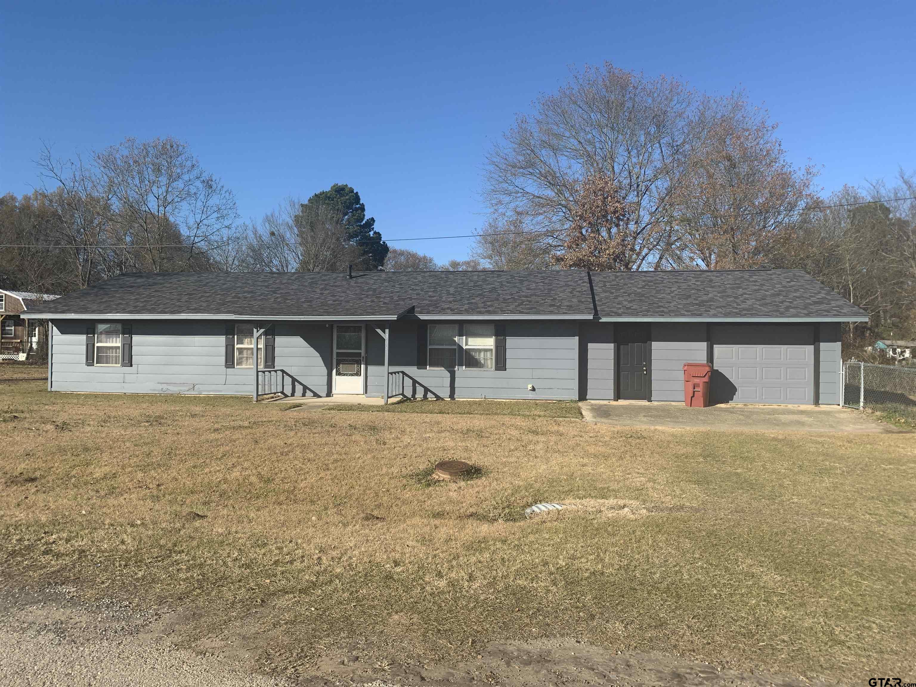 304 6th Street Southwest Bogata, TX 75417 - Photo 1 of 30 a front view of house with yard